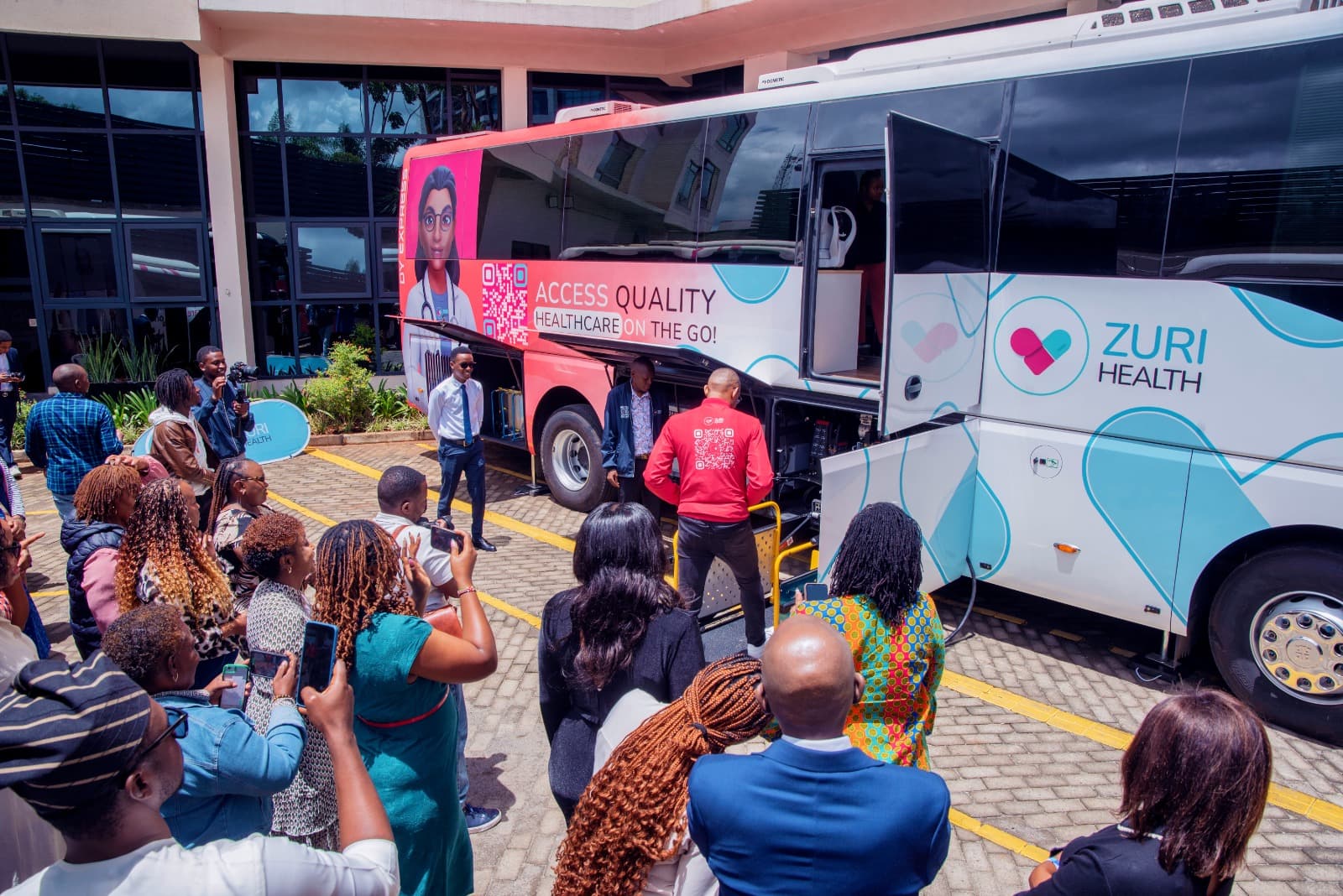 Media and press photographing the Zuri Express mobile hospital at the launch event