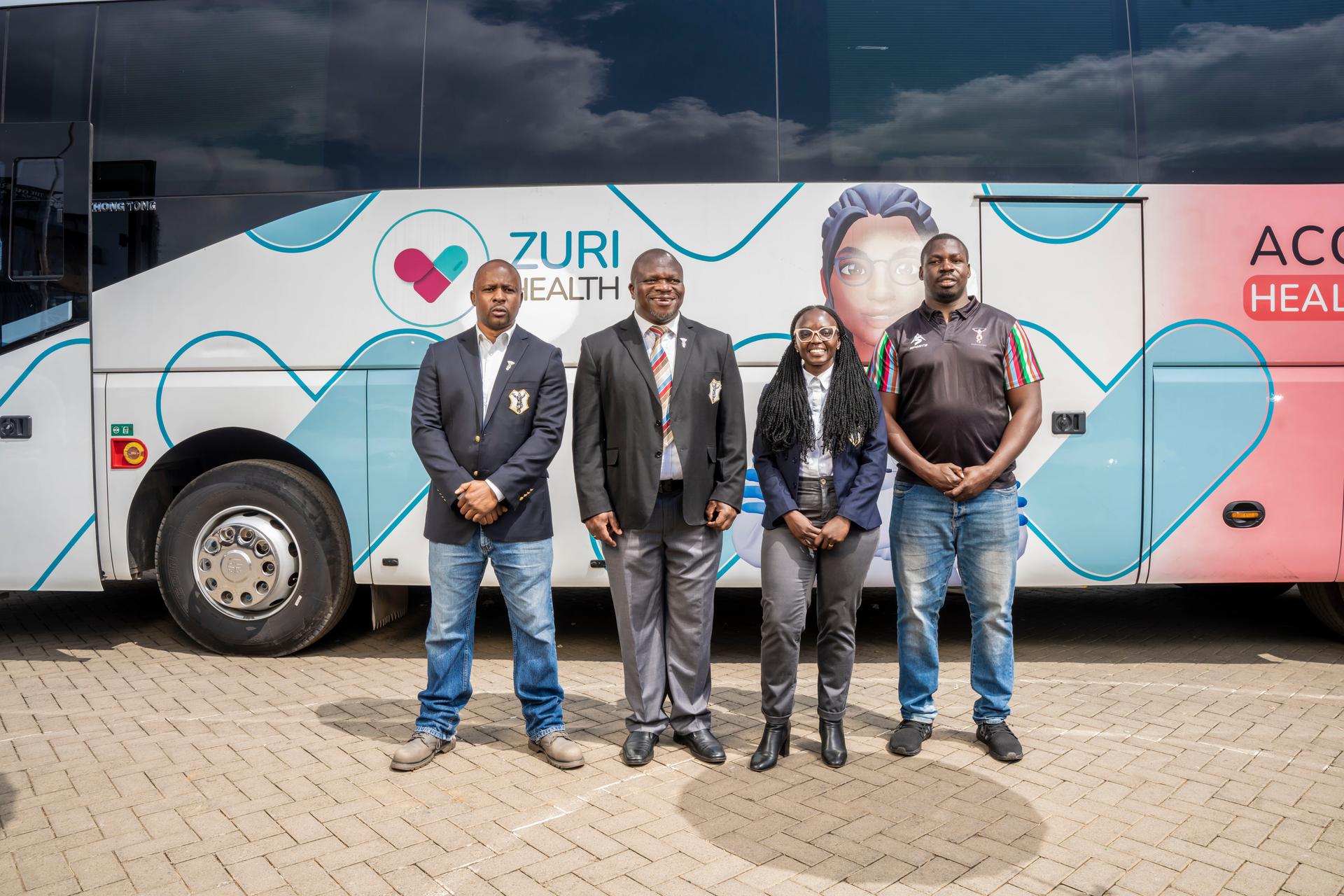 Kenya Harlequin FC and Zuri Health officials in front of the Zuri Express mobile hospital