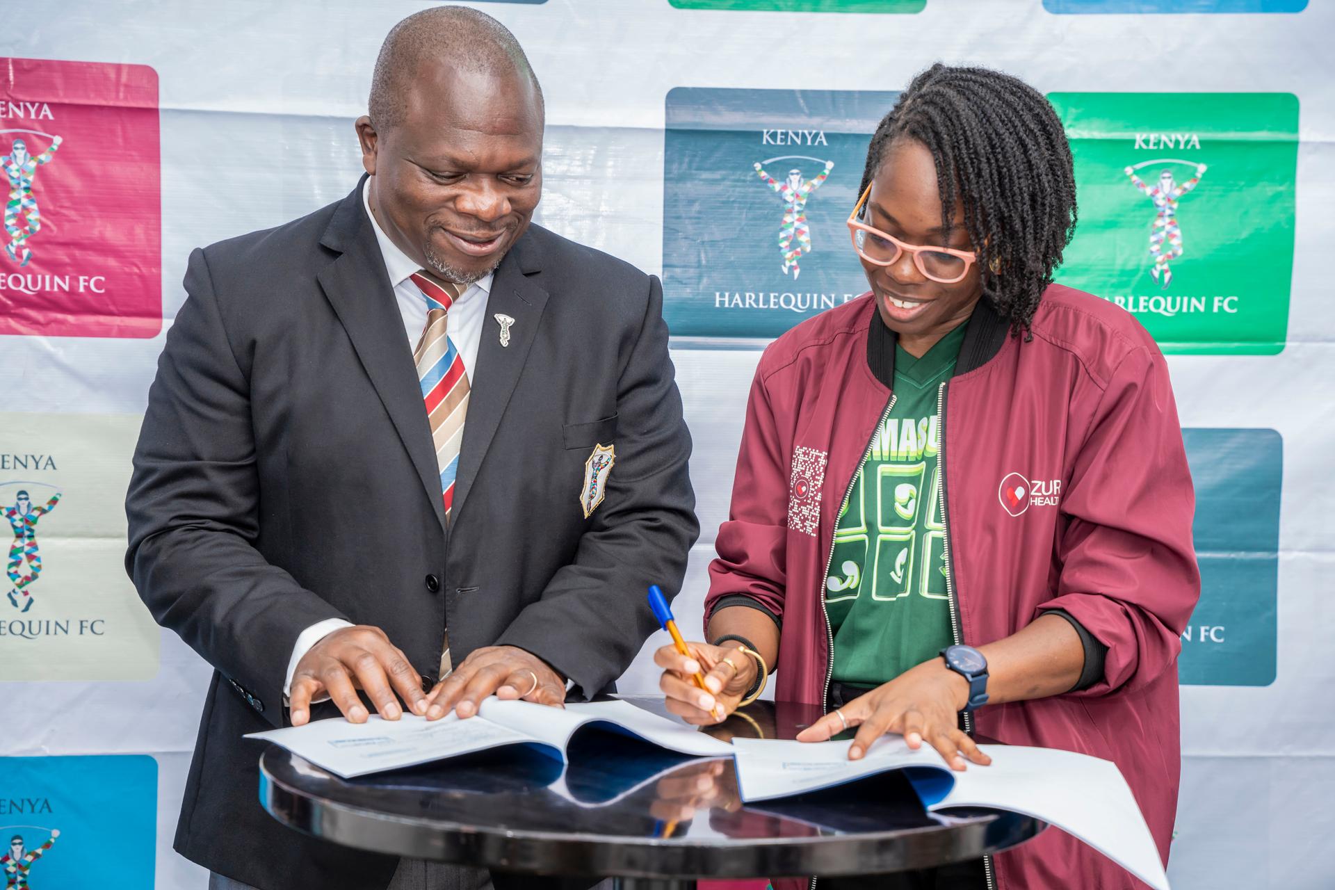Victor Sudi and Uchenna Ezedinachi signing the partnership agreement